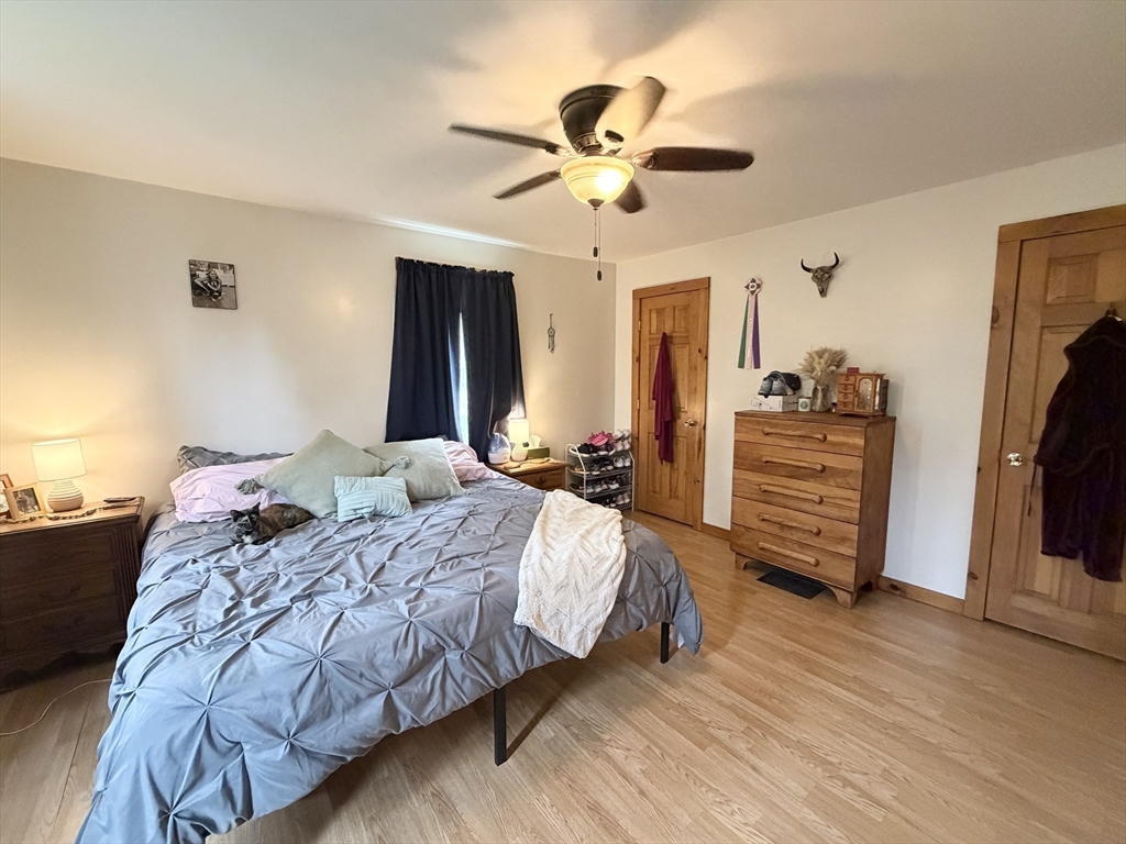 271 Lower Road Deerfield, MA 01342 - Photo 22 of 40 a bedroom with bed and a chandelier
