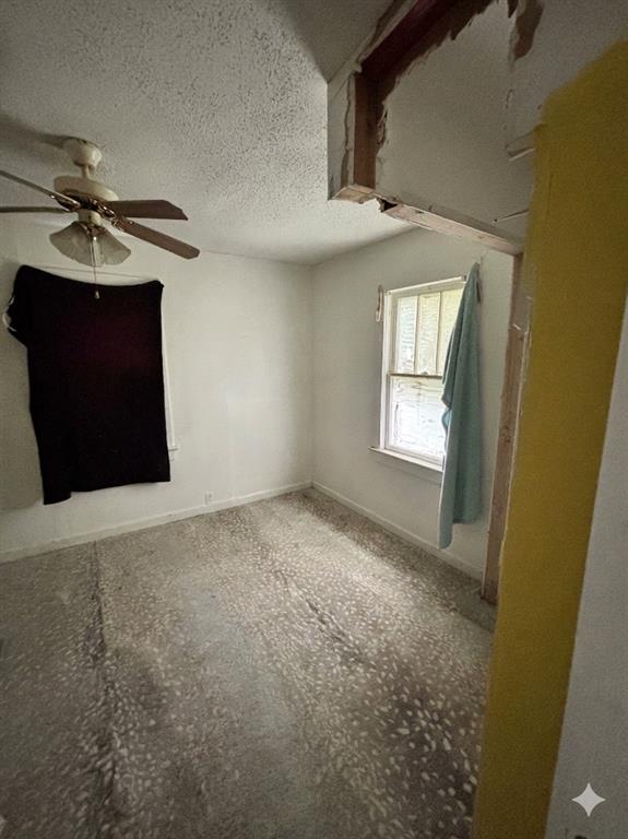 1918 North 6th Street, Unit R Wichita Falls, TX 76301 - Photo 3 of 14 an empty room with windows and fan