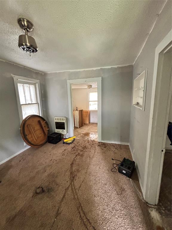 1918 North 6th Street, Unit R Wichita Falls, TX 76301 - Photo 5 of 14 a room with furniture and a rug