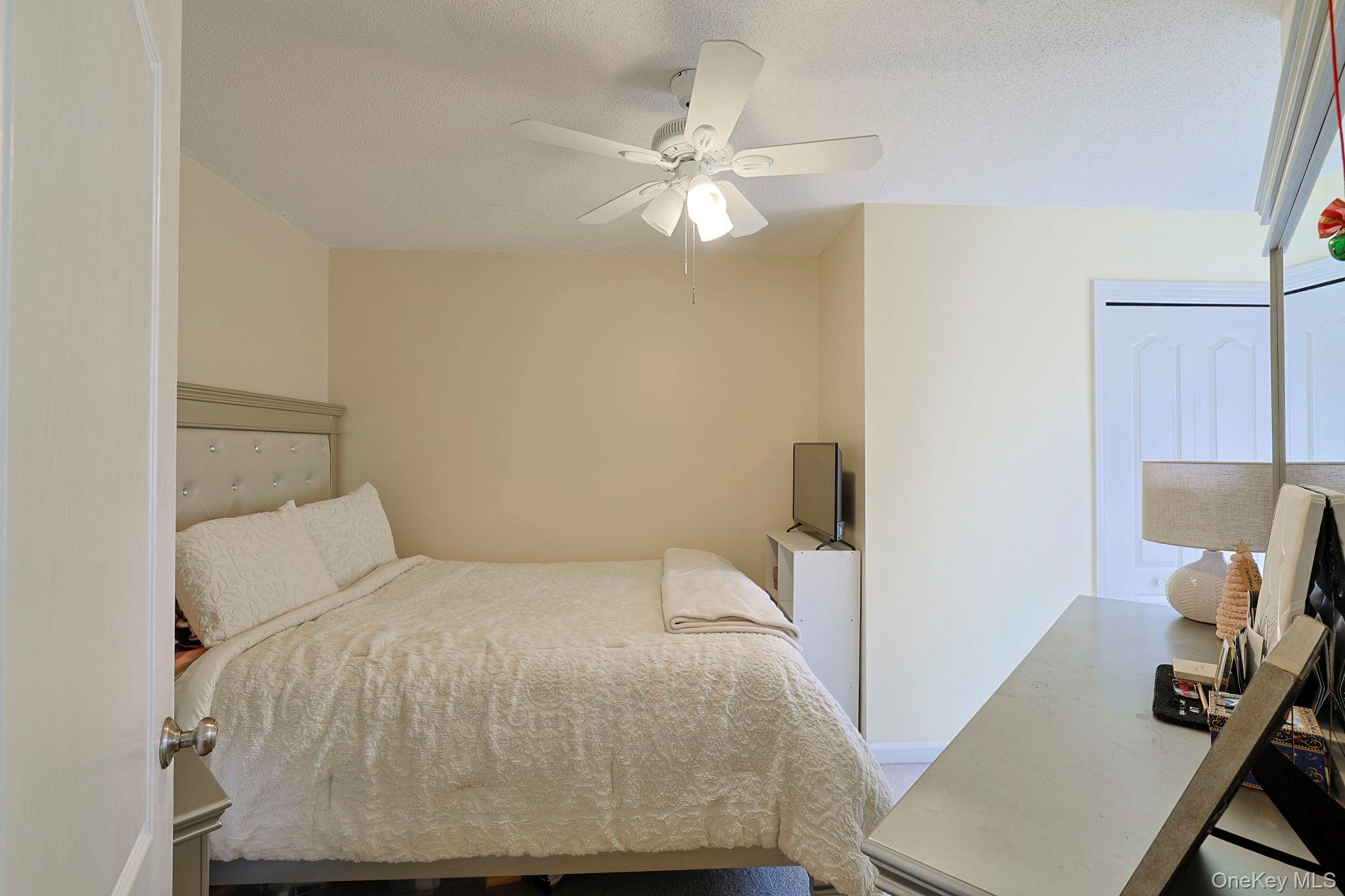 209 Crestwood Court Fishkill, NY 12524 - Photo 17 of 23 a bedroom with a bed and a desk