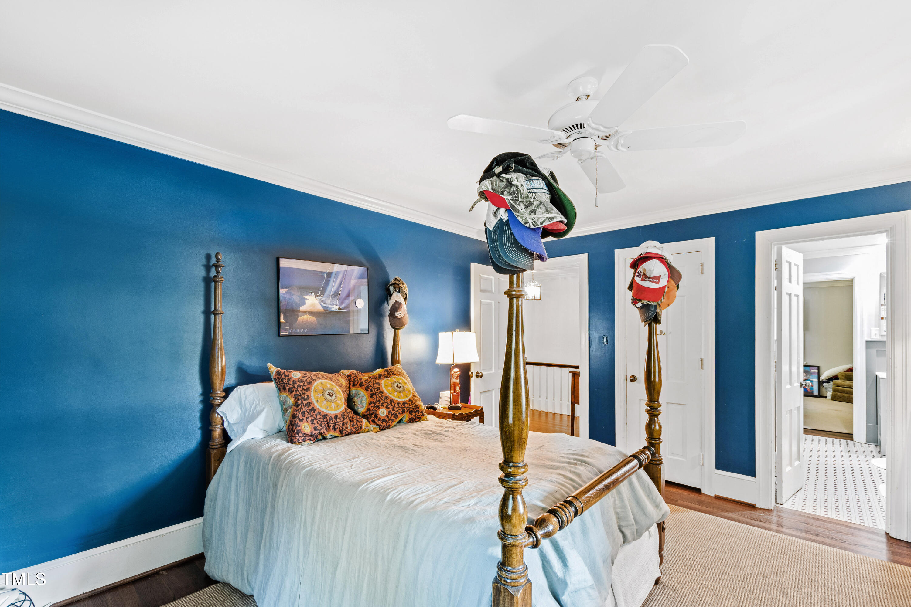 2525 White Oak Road Raleigh, NC 27609 - Photo 36 of 58 a bedroom with a bed and a chandelier