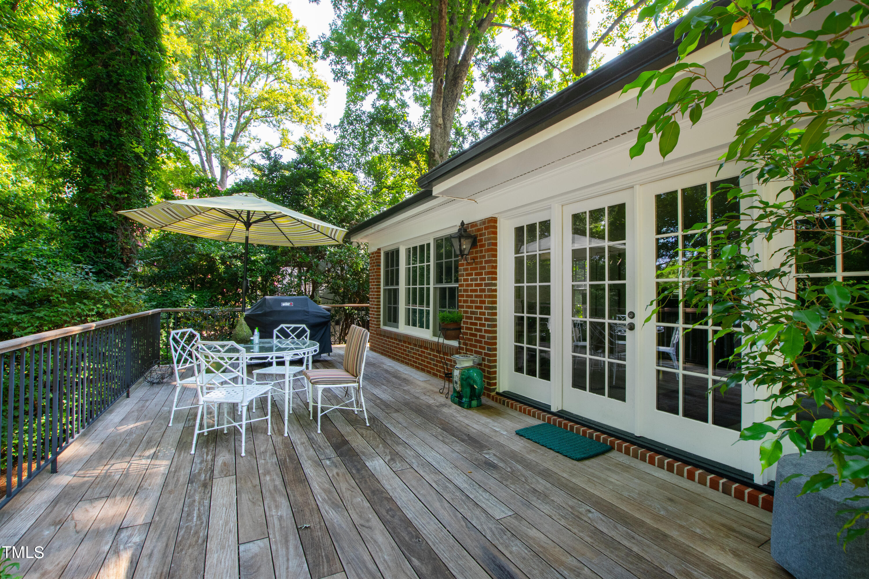 2525 White Oak Road Raleigh, NC 27609 - Photo 44 of 58 a view of a chair and table on the wooden deck