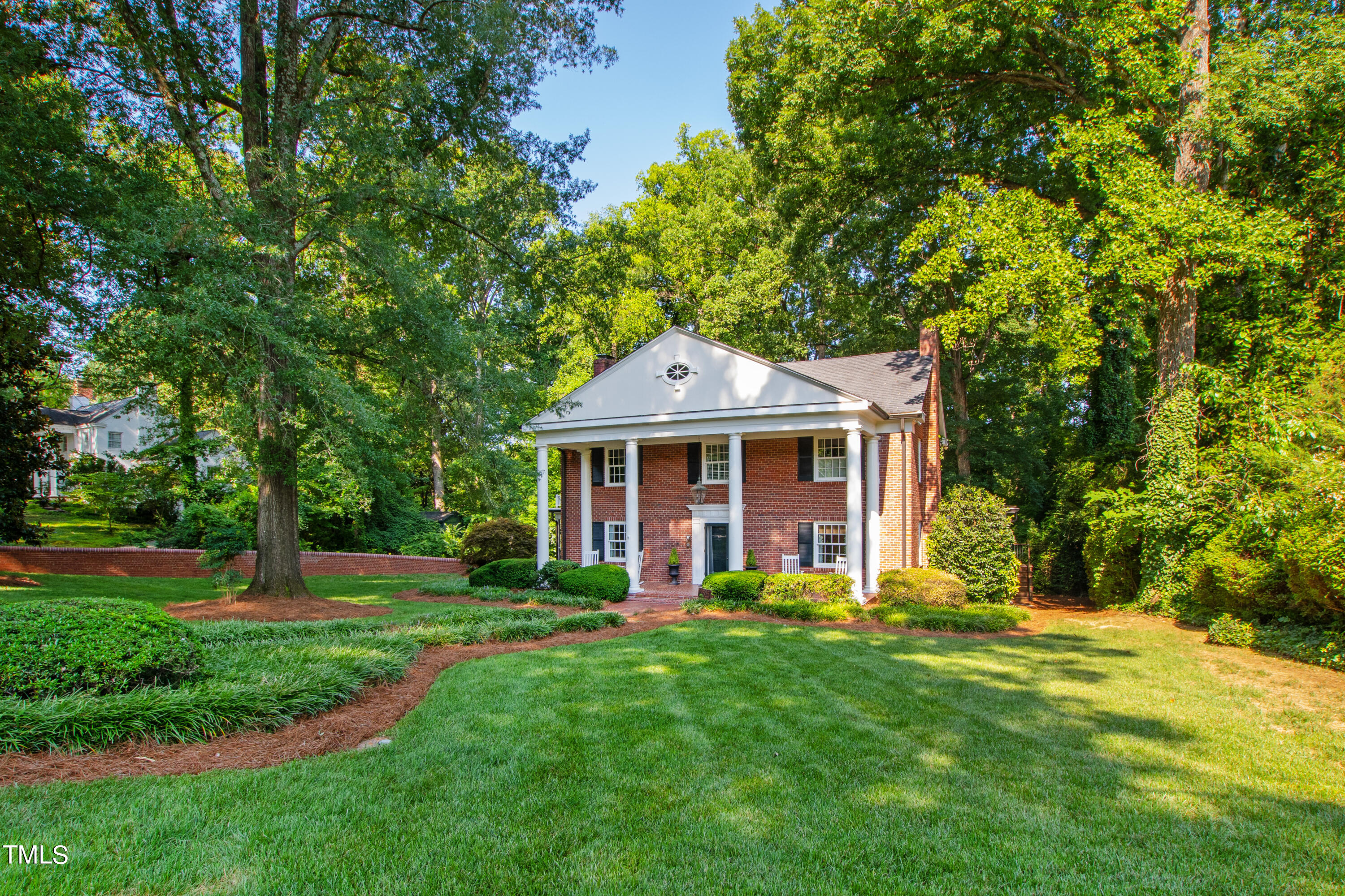 2525 White Oak Road Raleigh, NC 27609 - Photo 54 of 58 a front view of a house with a garden
