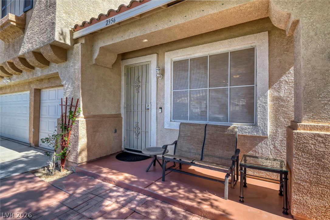 2356 Tilden Way Henderson, NV 89074 - Photo 4 of 30 A welcoming front patio offers a serene space for outdoor relaxation.
