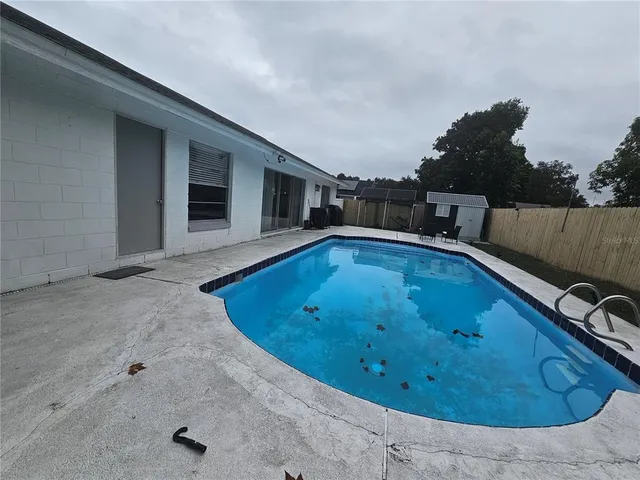a big house with a big yard and large trees