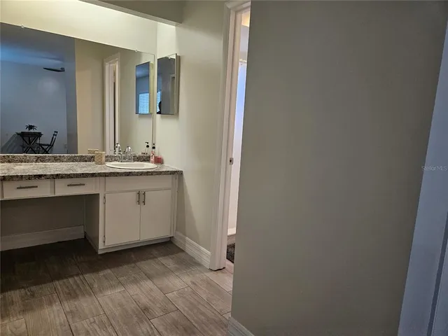 a white toilet sitting next to a shower