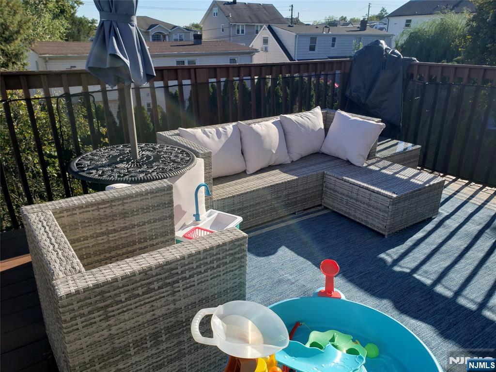 152 Miller Avenue, Unit 2 Elmwood Park, NJ 07407 - Photo 11 of 15 a view of a couches in the deck