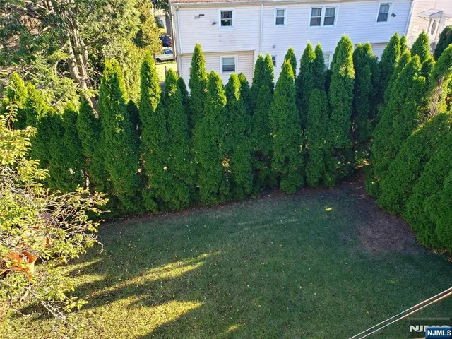 a view of a garden with a building
