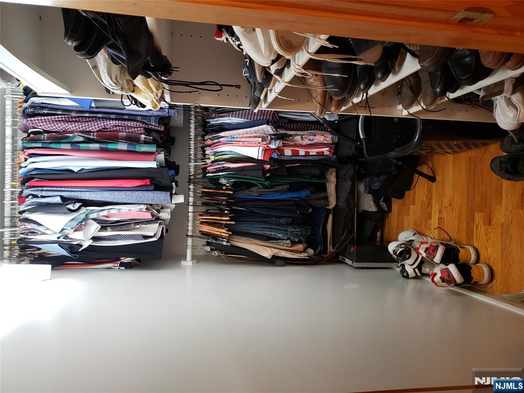 152 Miller Avenue, Unit 2 Elmwood Park, NJ 07407 - Photo 6 of 15 a view of walk in closet with clothes