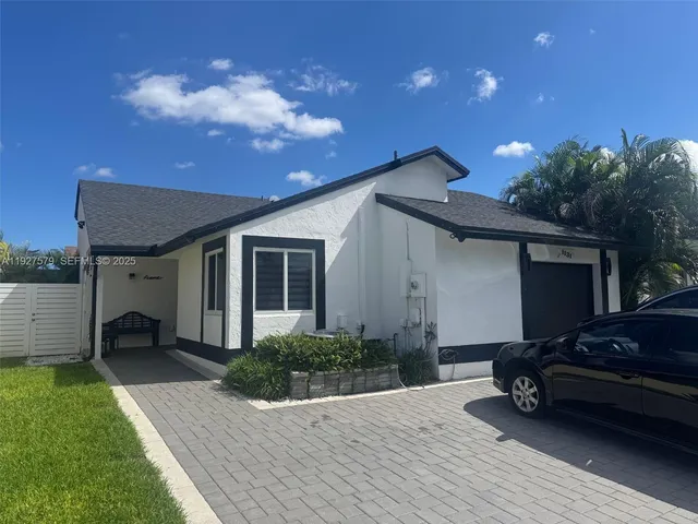 a house view with a garden space