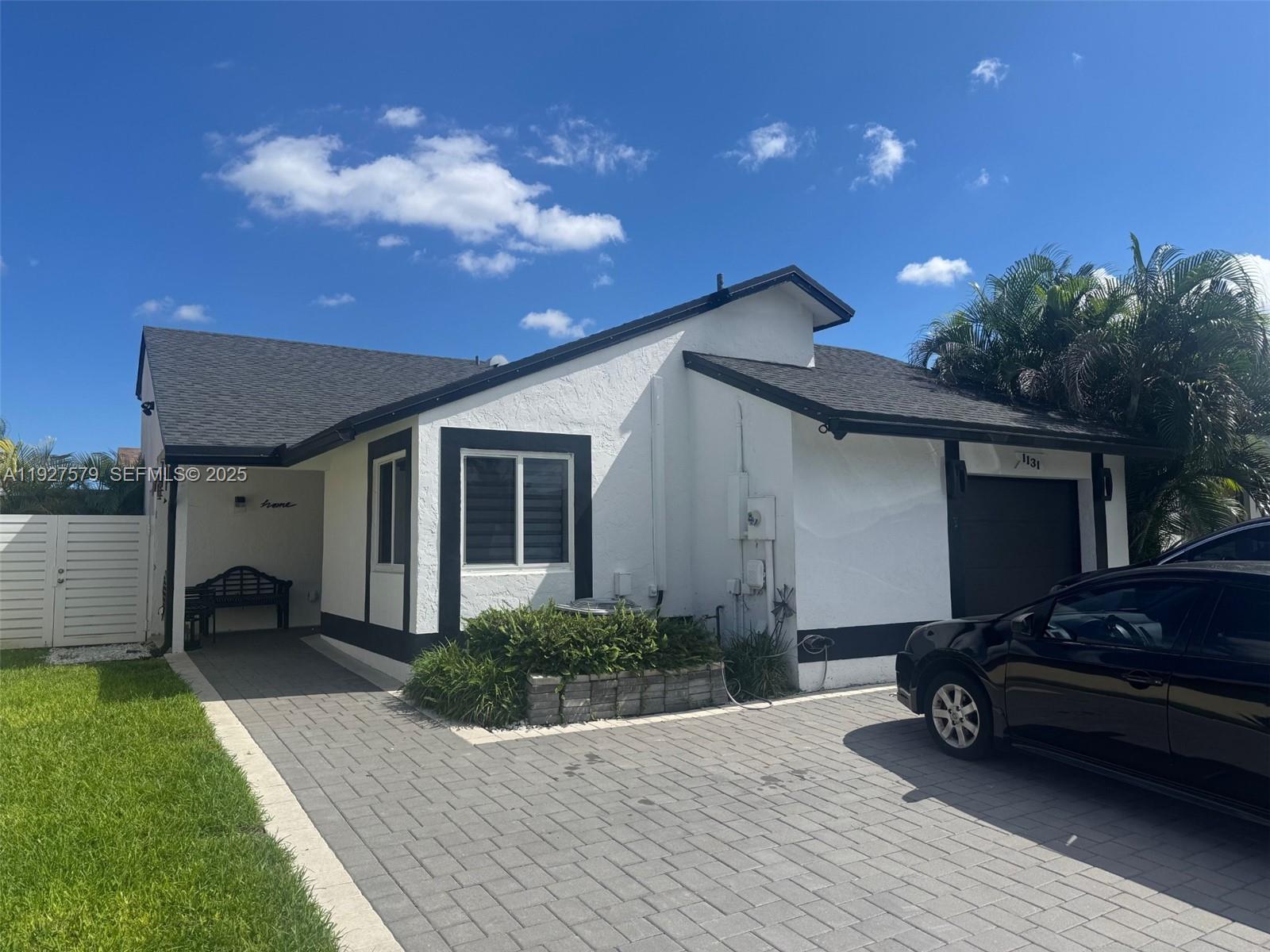 a house view with a garden space
