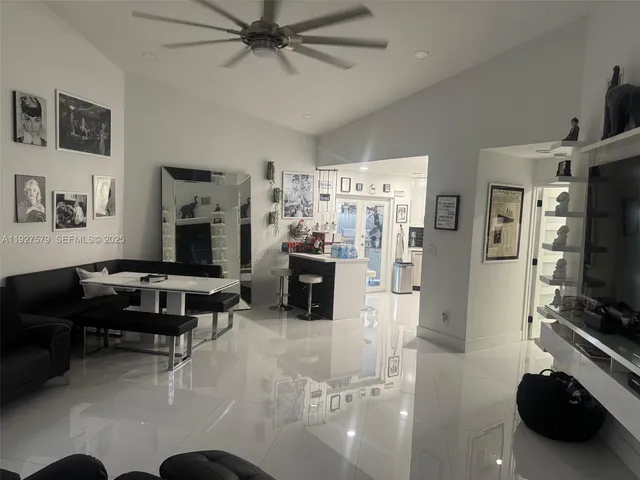 a view of a livingroom with workspace and a couch