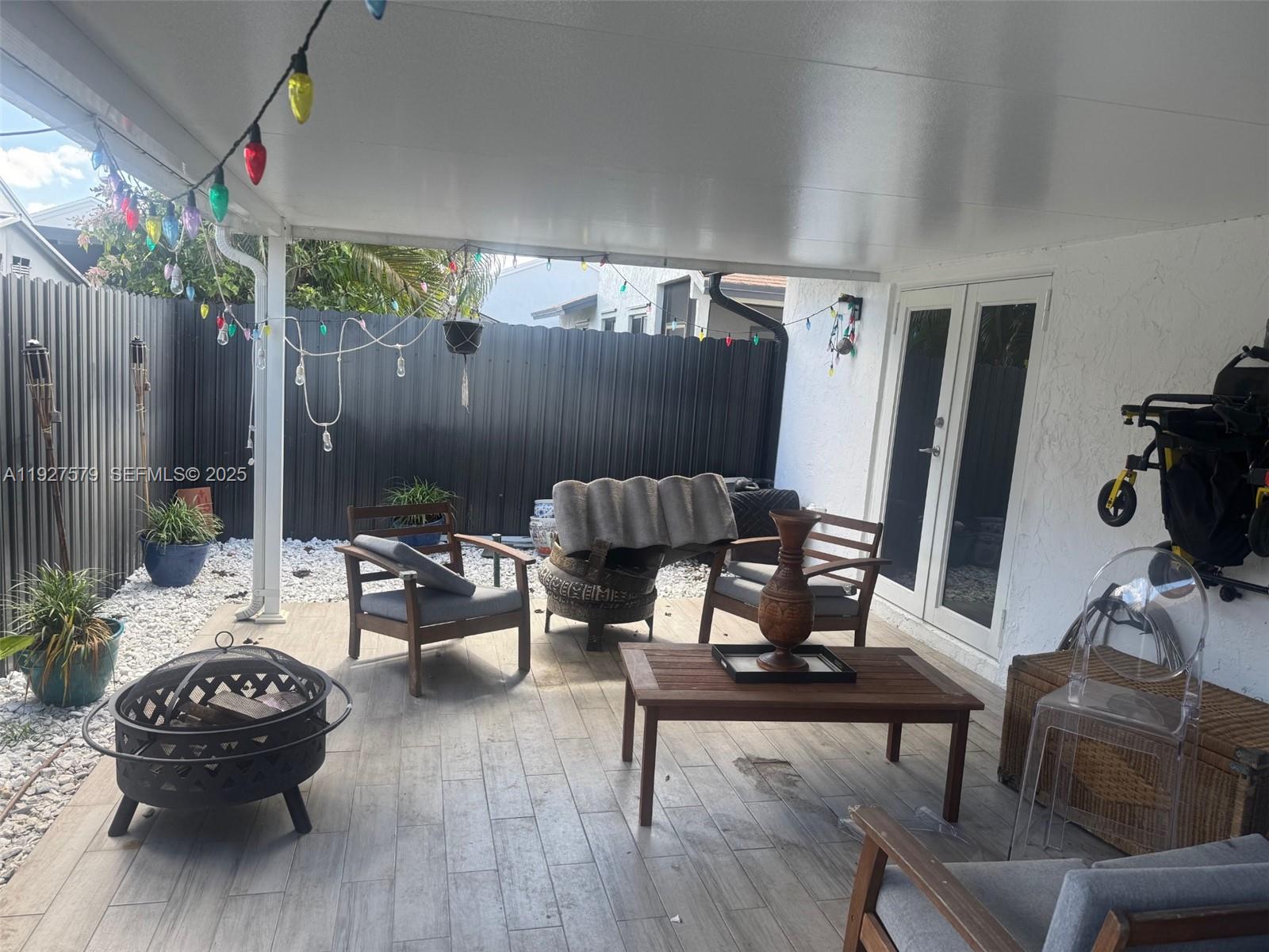 1131 Southwest 110th Avenue Pembroke Pines, FL 33025 - Photo 6 of 9 a view of a dining room with furniture and wooden floor