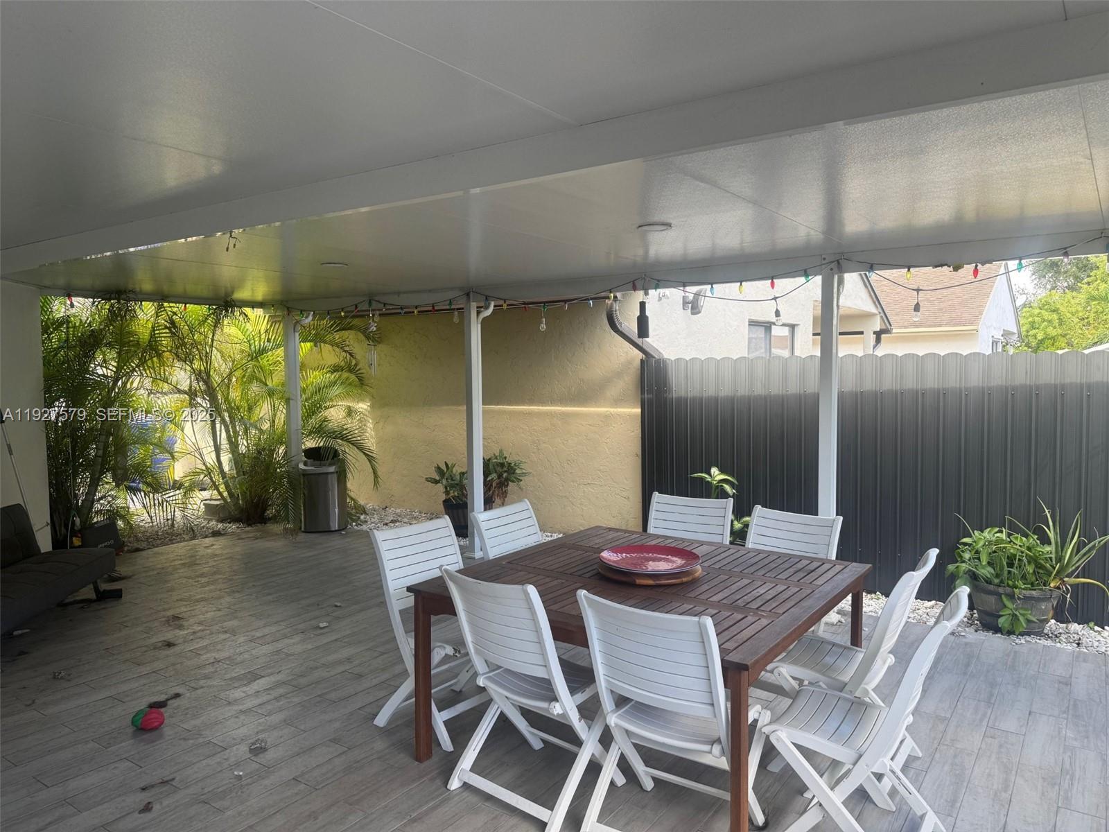 1131 Southwest 110th Avenue Pembroke Pines, FL 33025 - Photo 7 of 9 a view of a dining room with furniture window and outside view