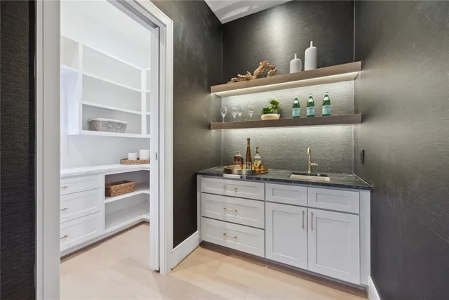a kitchen with cabinets and window