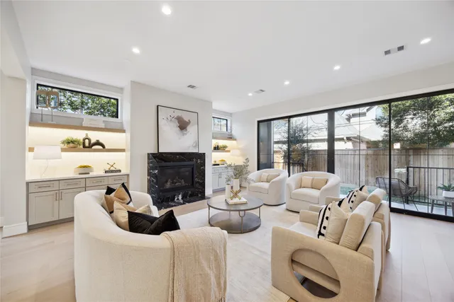 a living room with furniture large window and outer view