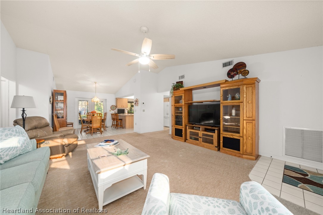 5802 Golden Road Sebring, FL 33875 - Photo 7 of 37 a living room with furniture and a flat screen tv