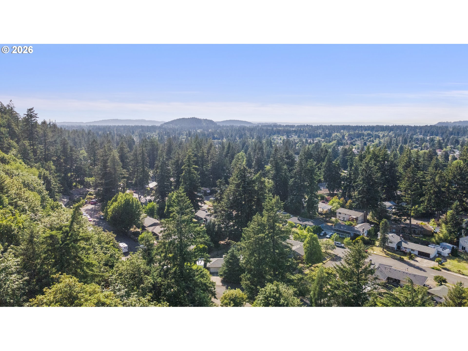 4024 Southeast 154th Place Portland, OR 97236 - Photo 38 of 43 a view of a city with lush green forest