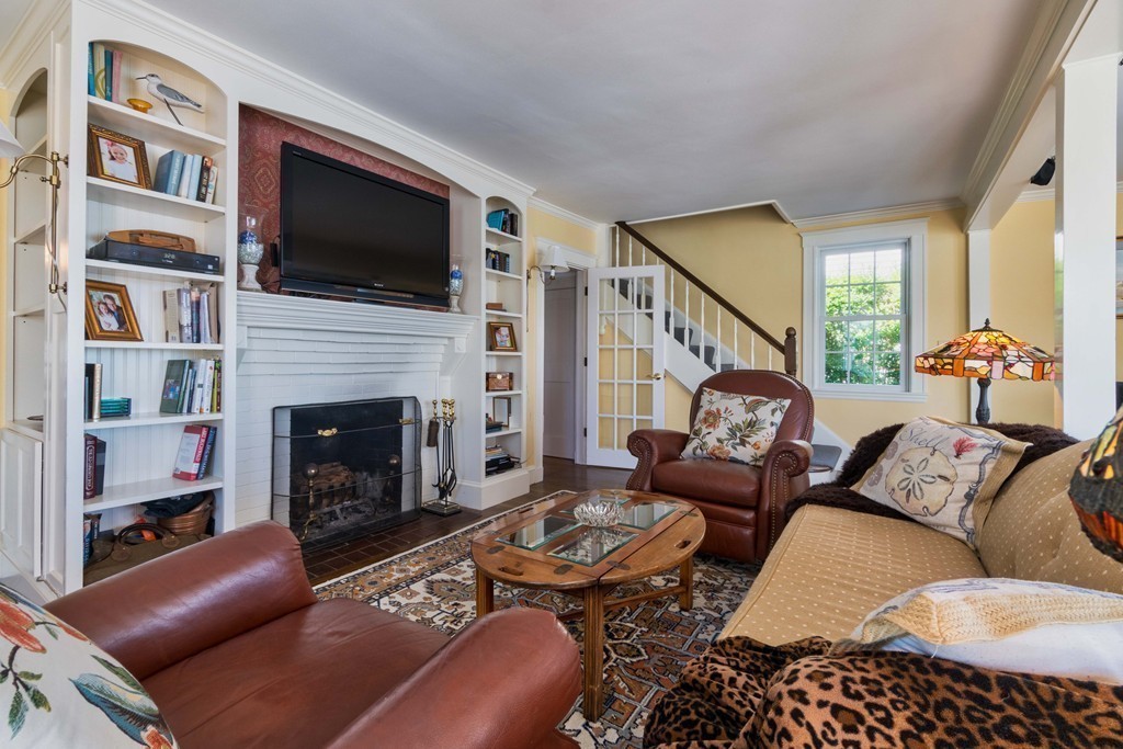 185 Downer Avenue Hingham, MA 02043 - Photo 14 of 30 a living room with furniture fireplace and flat screen tv