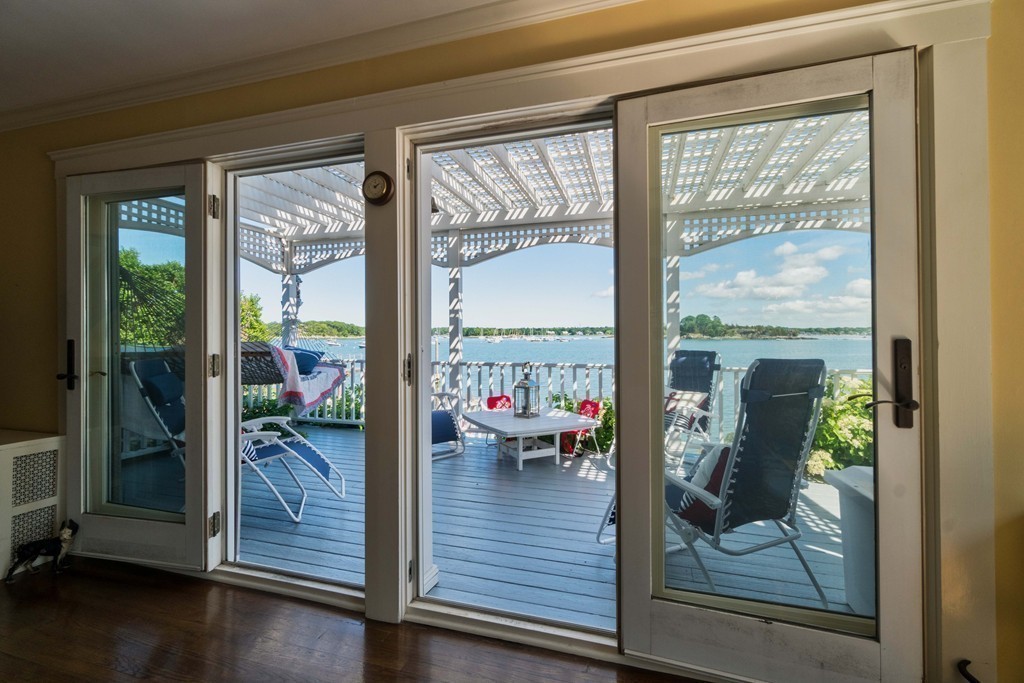 185 Downer Avenue Hingham, MA 02043 - Photo 16 of 30 a view of a living room and floor to ceiling window