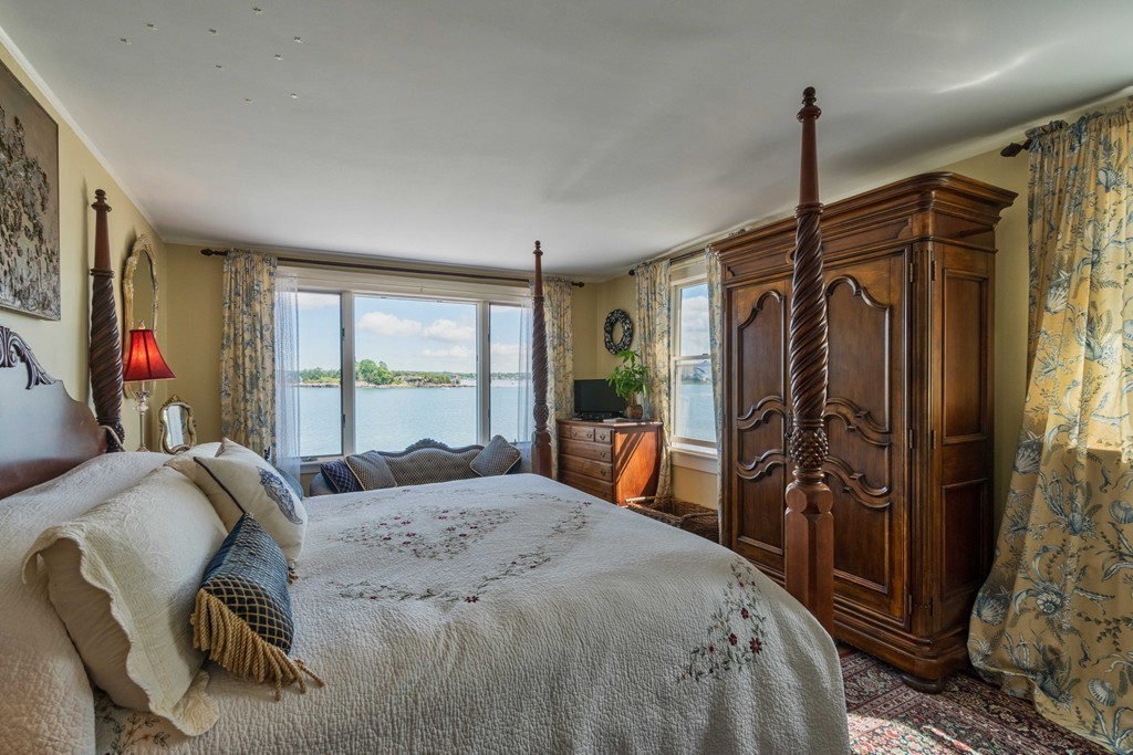 185 Downer Avenue Hingham, MA 02043 - Photo 19 of 30 a bed room with a bed and a mirror