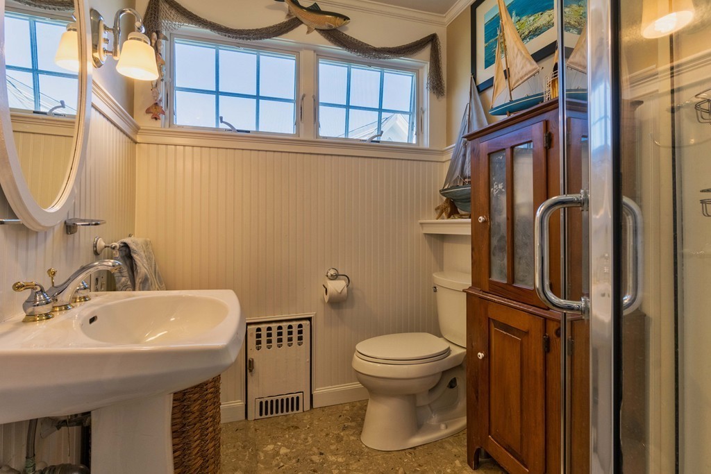 185 Downer Avenue Hingham, MA 02043 - Photo 21 of 30 a bathroom with a sink a toilet and shower