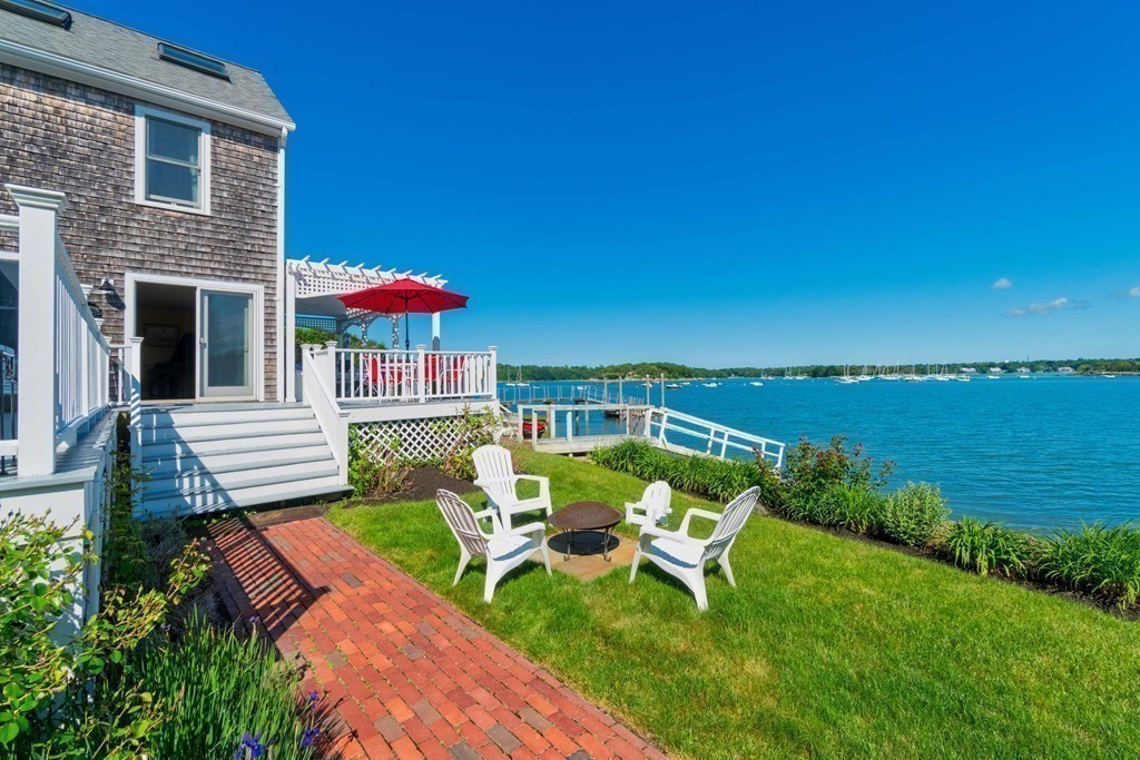 185 Downer Avenue Hingham, MA 02043 - Photo 3 of 30 a view of a patio with chairs and a table