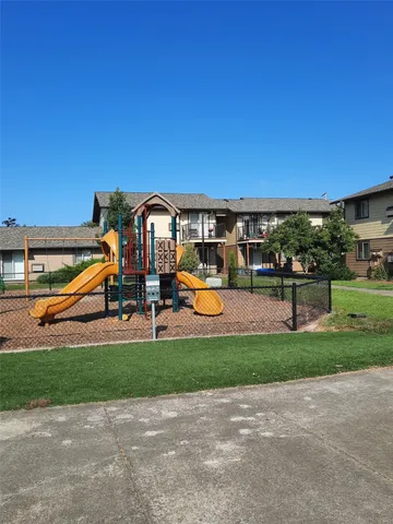 a view of a park with swings