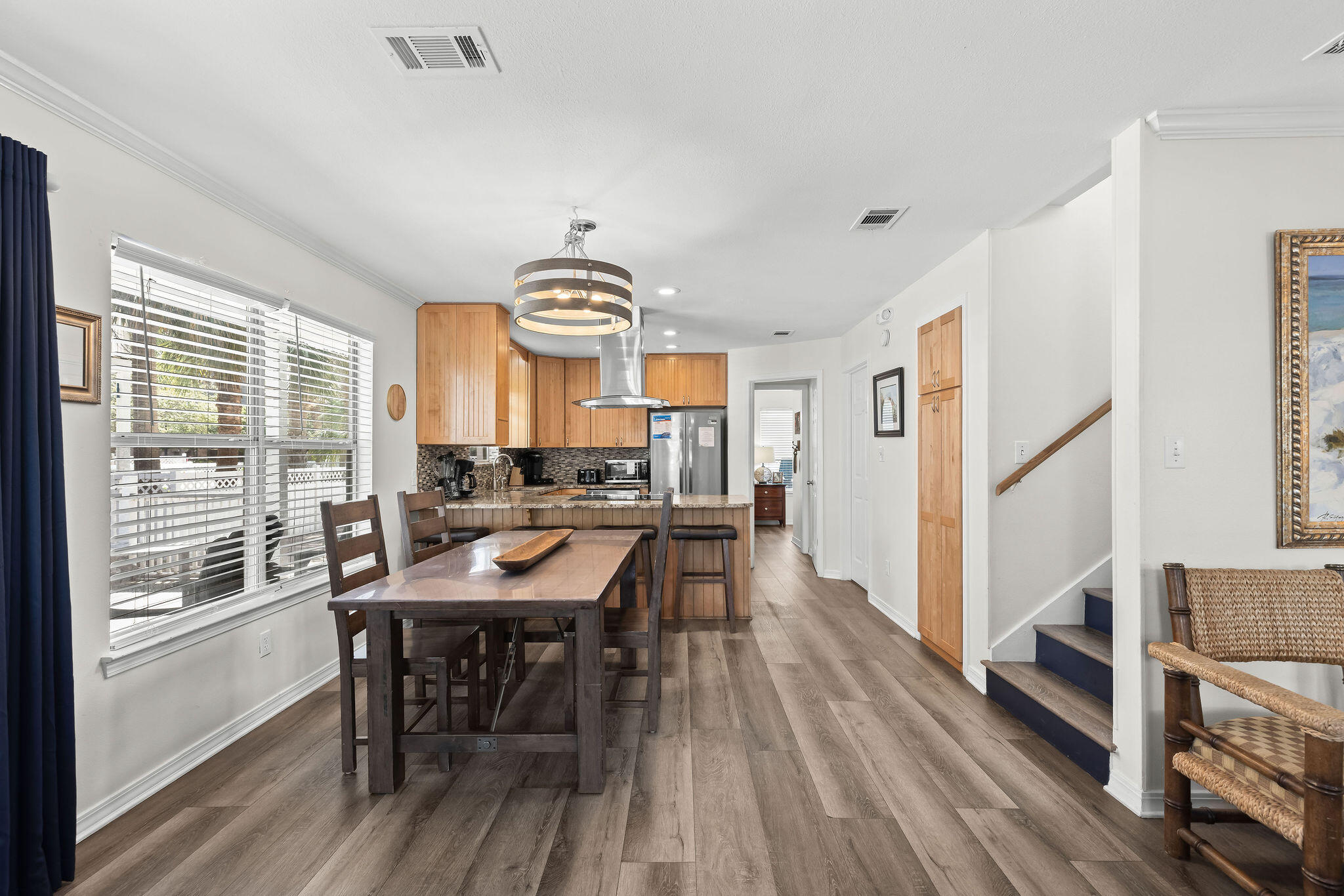 91 Matthew Boulevard Destin, FL 32541 - Photo 20 of 85 a view of a dining room with furniture window and wooden floor