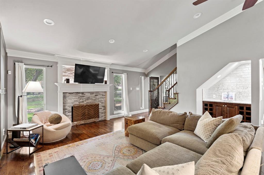 a living room with furniture or couch and a fireplace