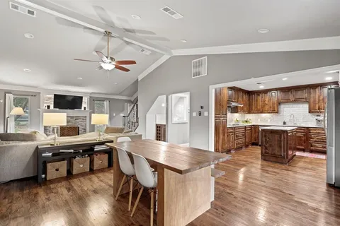 a bathroom with a sink vanity mirror and toilet