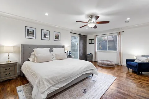 a view of a livingroom with workspace and a window