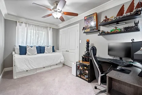 a view of a patio with couches and a table and chairs with wooden floor