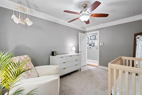 a view of house with a backyard