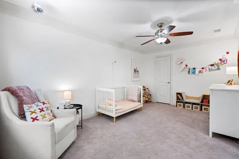 a view of a house with yard and a tree
