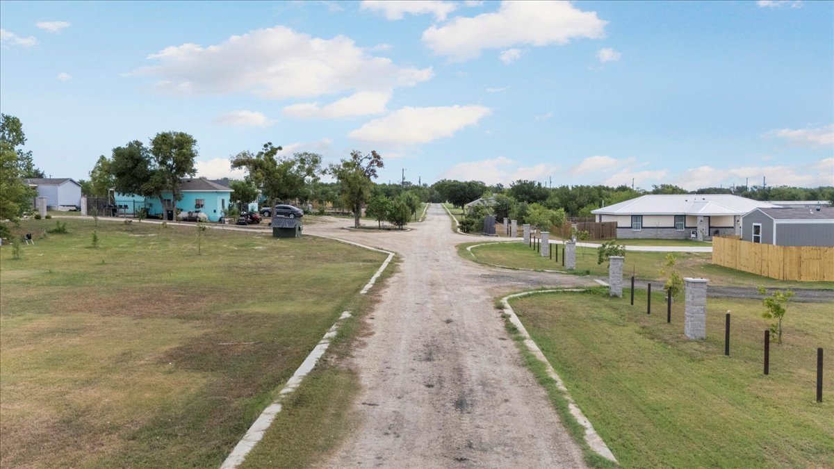Tbd Williamson Road Kyle, TX 78640 - Photo 2 of 33 a view of a swimming pool with a garden and trees