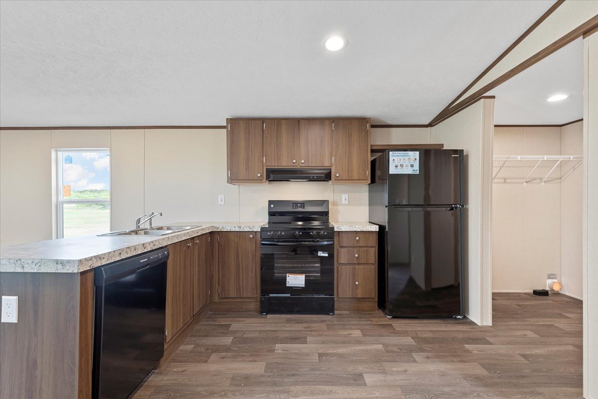 Tbd Williamson Road Kyle, TX 78640 - Photo 24 of 33 a kitchen with stainless steel appliances granite countertop a refrigerator and a sink
