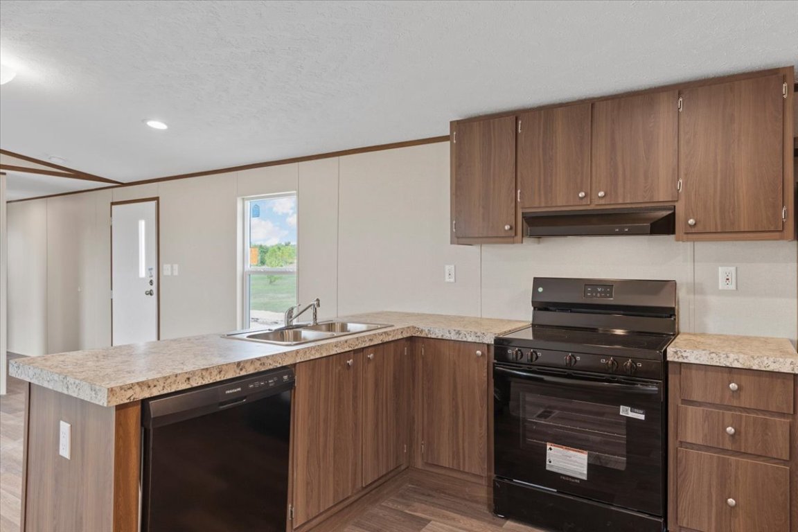 Tbd Williamson Road Kyle, TX 78640 - Photo 25 of 33 a kitchen with granite countertop a stove sink and cabinets