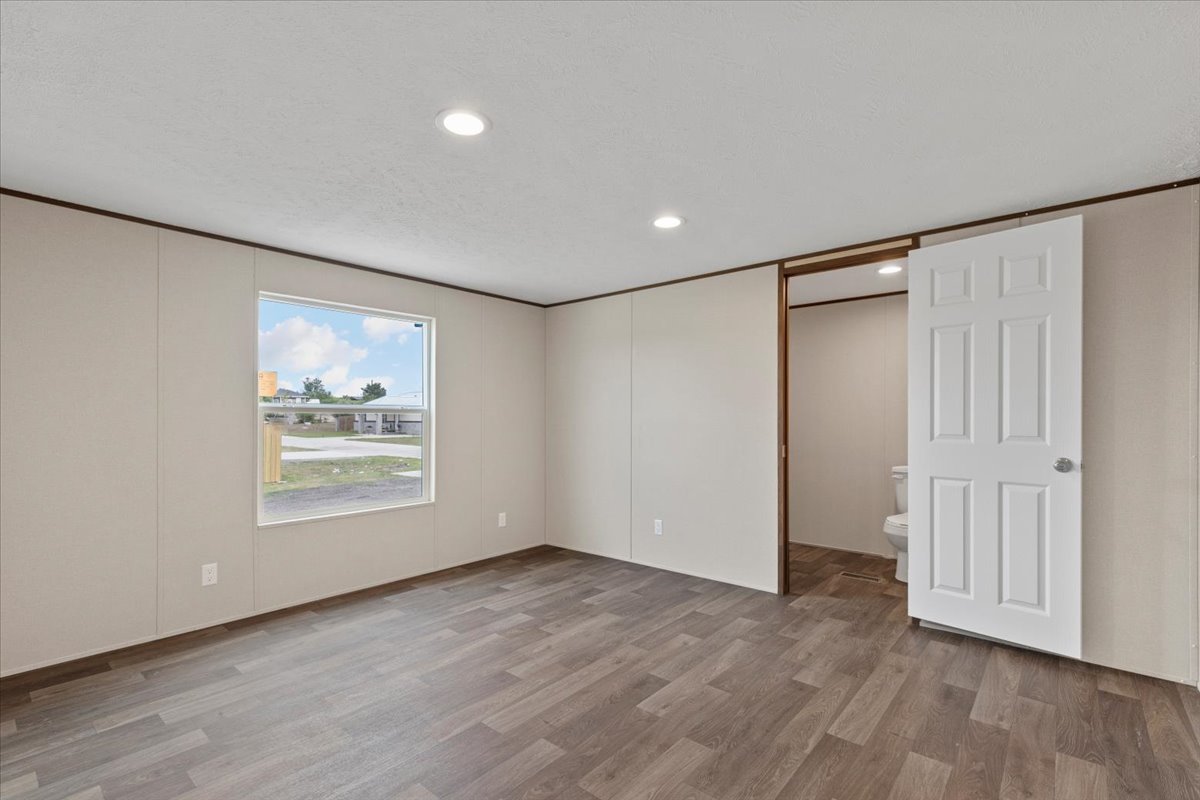 Tbd Williamson Road Kyle, TX 78640 - Photo 26 of 33 a view of an empty room with wooden floor and a window