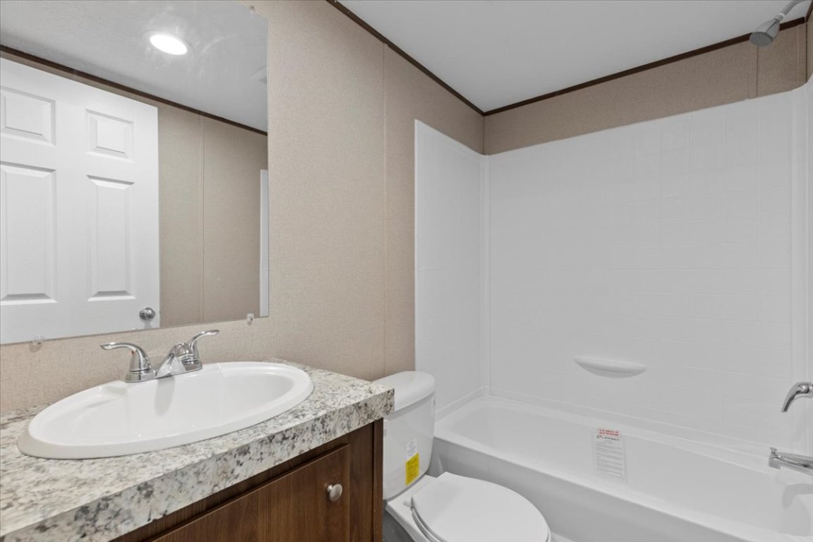 Tbd Williamson Road Kyle, TX 78640 - Photo 32 of 33 a bathroom with a granite countertop sink and a mirror