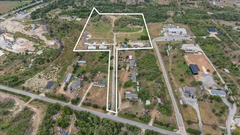 an aerial view of residential house with outdoor space and parking