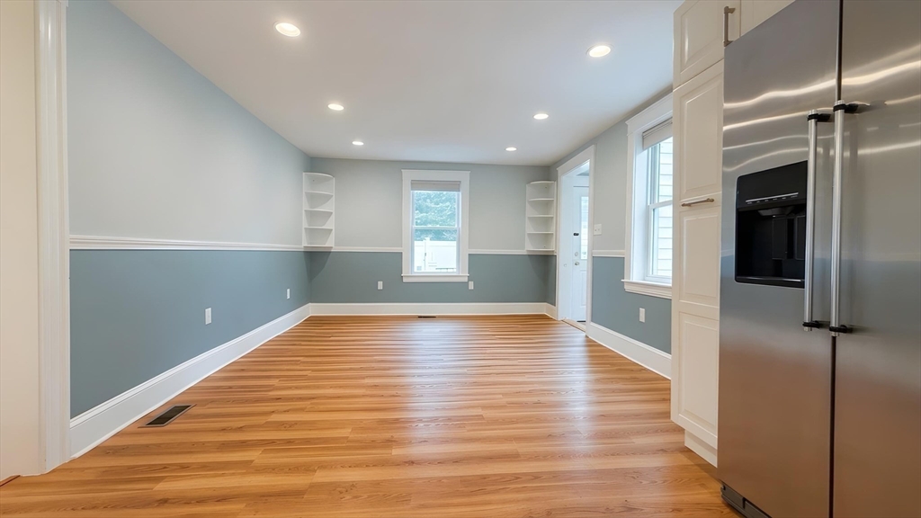 114 Curve Street Dedham, MA 02026 - Photo 9 of 27 a view of empty room with wooden floor