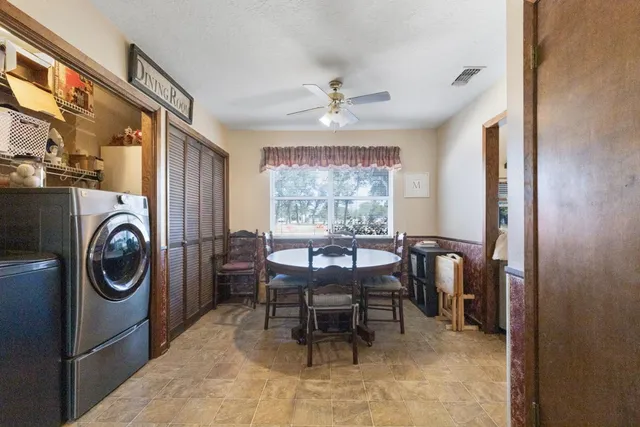 a view of a dining room with furniture window and outside view