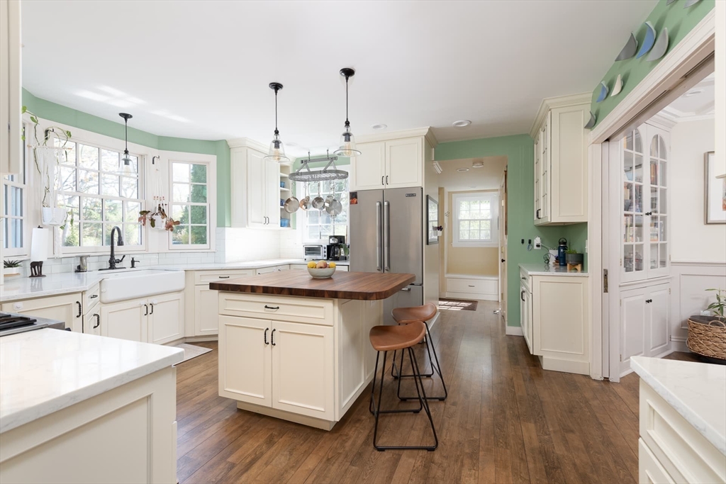 20 Maple Road Weston, MA 02493 - Photo 12 of 42 a kitchen with granite countertop a sink appliances cabinets and wooden floor