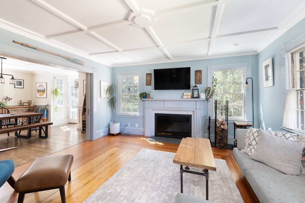 20 Maple Road Weston, MA 02493 - Photo 17 of 42 a living room with furniture a fireplace and a flat screen tv