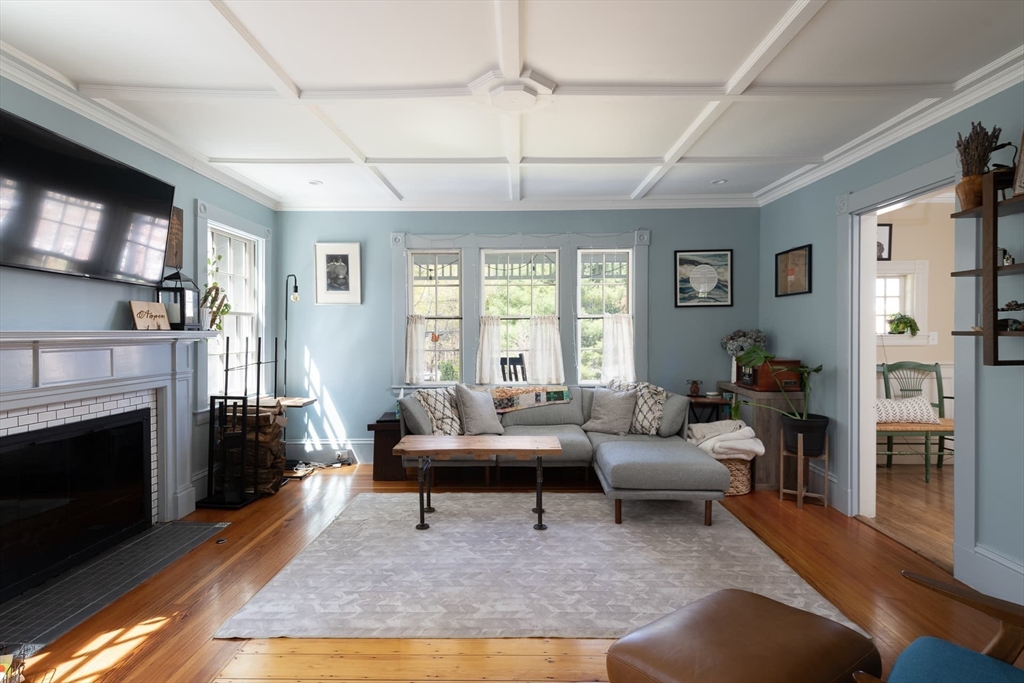 20 Maple Road Weston, MA 02493 - Photo 18 of 42 a living room with furniture a fireplace and a flat screen tv