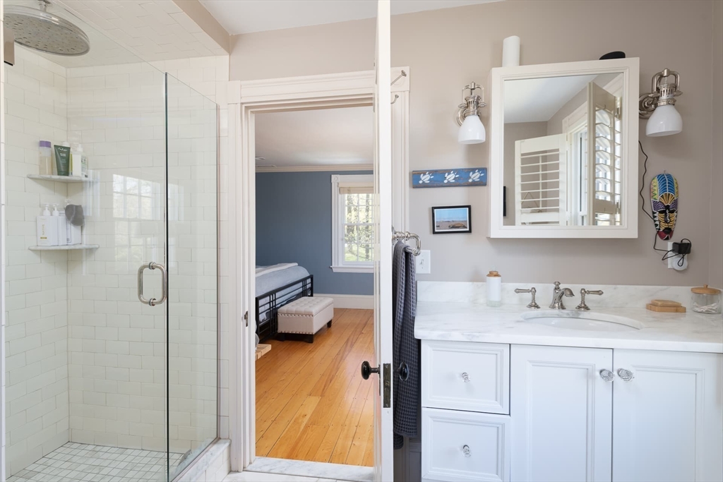 20 Maple Road Weston, MA 02493 - Photo 20 of 42 a en suite bathroom with a granite countertop sink and a mirror