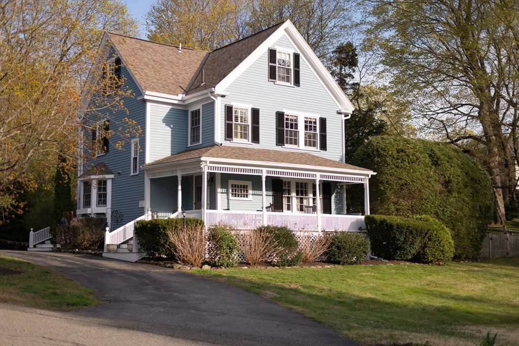 20 Maple Road Weston, MA 02493 - Photo 2 of 42 a front view of a house with a garden and trees