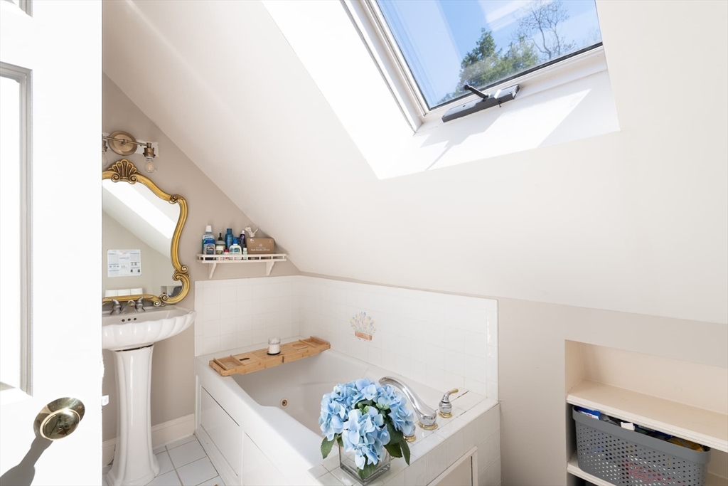 20 Maple Road Weston, MA 02493 - Photo 25 of 42 a bathroom with a tub sink and mirror