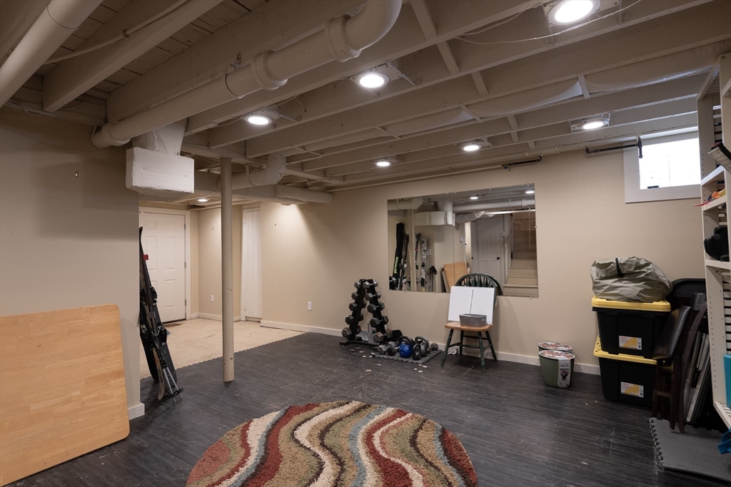 20 Maple Road Weston, MA 02493 - Photo 28 of 42 a room with furniture and wooden floor